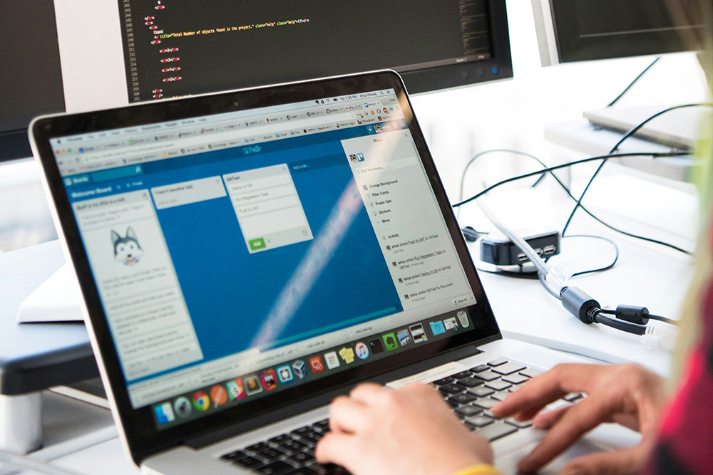 Accessibility expert sitting at a desk working on a project